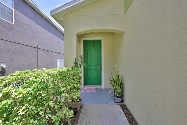 6314 Magnolia Trails Ln, Gibsonton, FL 33534 - doorway to property featuring stucco siding