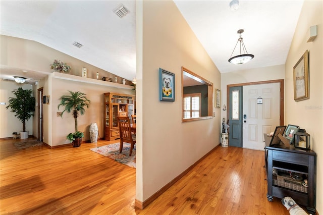 1008 Mallow Way, Brandon, FL 33510 - entrance foyer featuring vaulted ceiling and light wood-style flooring