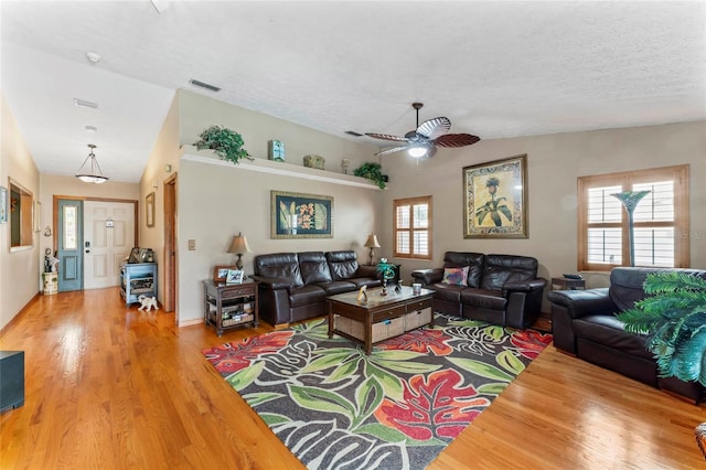 1008 Mallow Way, Brandon, FL 33510 - living room featuring wood finished floors, ceiling fan, and a textured ceiling