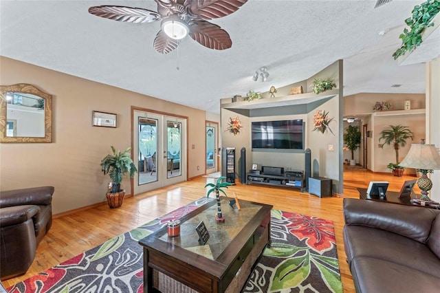 1008 Mallow Way, Brandon, FL 33510 - living area with a ceiling fan, wood finished floors, vaulted ceiling, and french doors