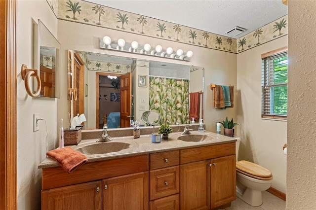 1008 Mallow Way, Brandon, FL 33510 - bathroom with double vanity and toilet