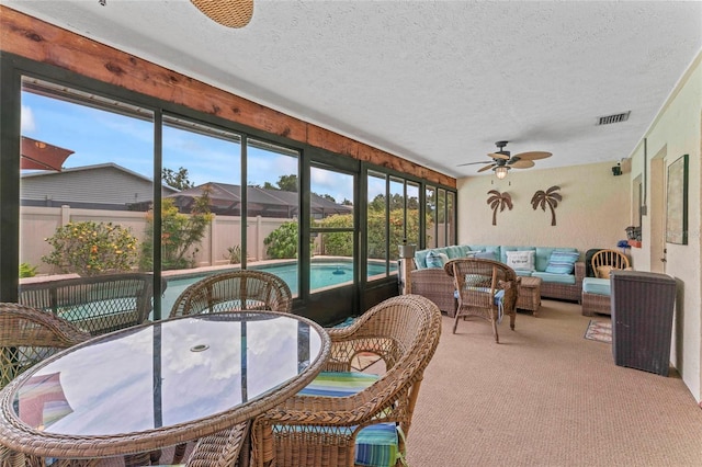 1008 Mallow Way, Brandon, FL 33510 - sunroom featuring outdoor lounge area, ceiling fan, and outdoor dining space