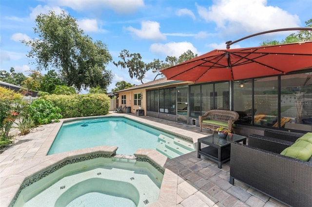 1008 Mallow Way, Brandon, FL 33510 - view of swimming pool featuring a patio, a pool with connected hot tub, a sunroom, and outdoor lounge area