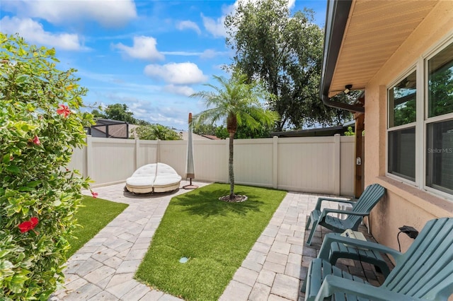 1008 Mallow Way, Brandon, FL 33510 - fenced backyard with a patio area