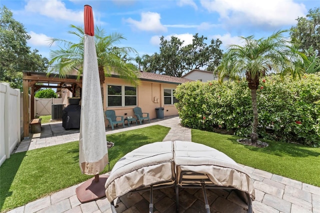 1008 Mallow Way, Brandon, FL 33510 - back of property featuring a patio area, stucco siding, and a gate