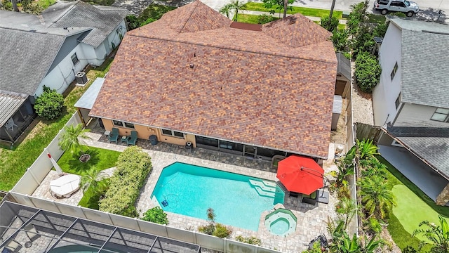 1008 Mallow Way, Brandon, FL 33510 - view of pool featuring a patio, a fenced backyard, and a pool with connected hot tub