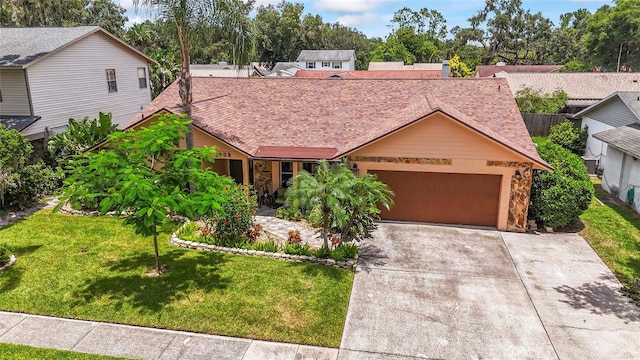 1008 Mallow Way, Brandon, FL 33510 - view of front of property featuring a garage, a front lawn, driveway, and a shingled roof