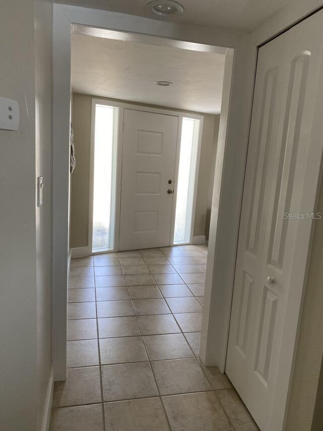 2569 Brazilia Ct, Punta Gorda, FL 33950 - foyer featuring light tile patterned flooring and baseboards