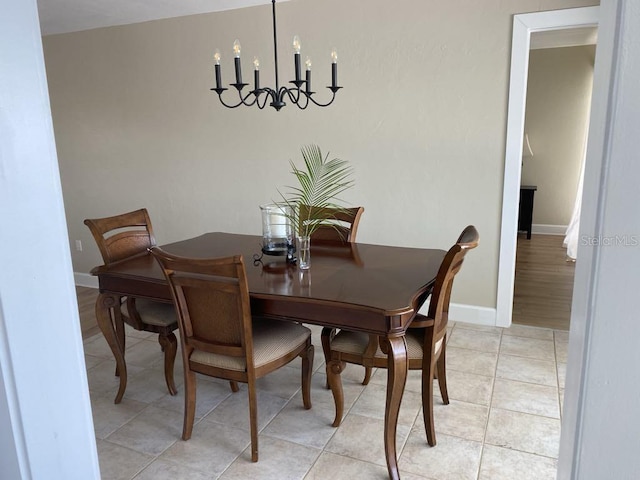 2569 Brazilia Ct, Punta Gorda, FL 33950 - dining room featuring a chandelier and light tile patterned floors