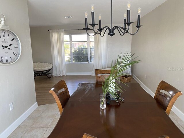 2569 Brazilia Ct, Punta Gorda, FL 33950 - dining room with a chandelier and baseboards
