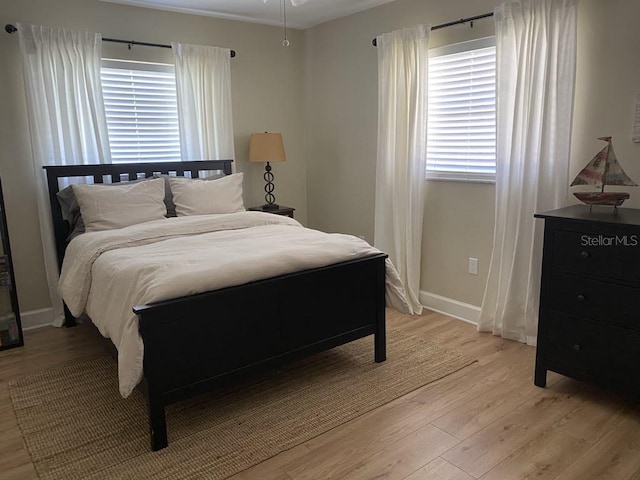 2569 Brazilia Ct, Punta Gorda, FL 33950 - bedroom with light wood-style flooring and baseboards