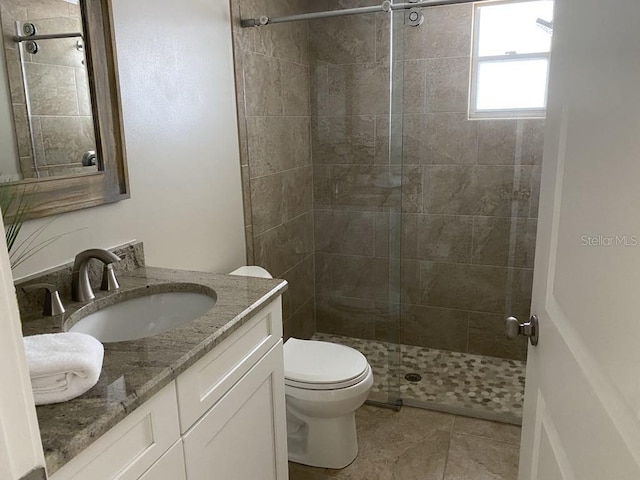 2569 Brazilia Ct, Punta Gorda, FL 33950 - bathroom featuring vanity, a tile shower, and tile patterned floors