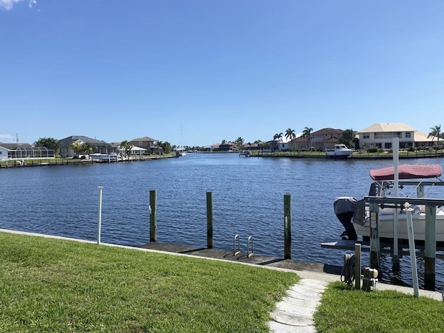 2569 Brazilia Ct, Punta Gorda, FL 33950 - dock with a water view, a residential view, and a yard