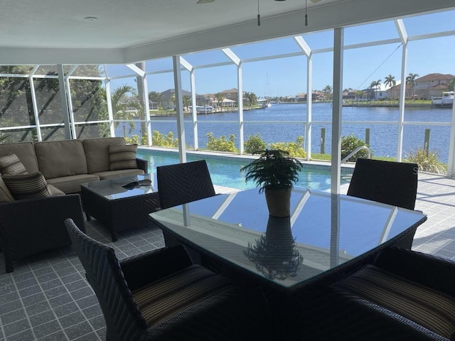 2569 Brazilia Ct, Punta Gorda, FL 33950 - sunroom / solarium with an outdoor living space, a water view, and a swimming pool