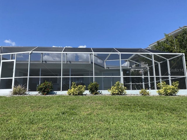 2569 Brazilia Ct, Punta Gorda, FL 33950 - rear view of property featuring a yard and a lanai