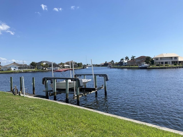 2569 Brazilia Ct, Punta Gorda, FL 33950 - dock area featuring boat lift, a water view, and a residential view