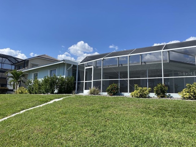 2569 Brazilia Ct, Punta Gorda, FL 33950 - rear view of house featuring a yard and a lanai
