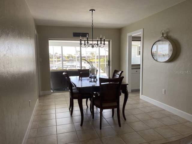 2569 Brazilia Ct, Punta Gorda, FL 33950 - dining room featuring a chandelier and light tile patterned floors