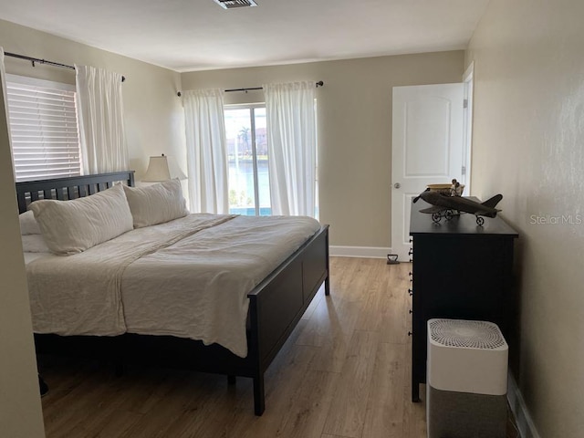 2569 Brazilia Ct, Punta Gorda, FL 33950 - bedroom with light wood-style floors and baseboards