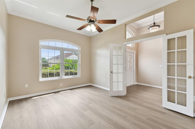 5321 Silver Charm Ter, Wesley Chapel, FL 33544 - empty room featuring crown molding, light wood finished floors, and a ceiling fan