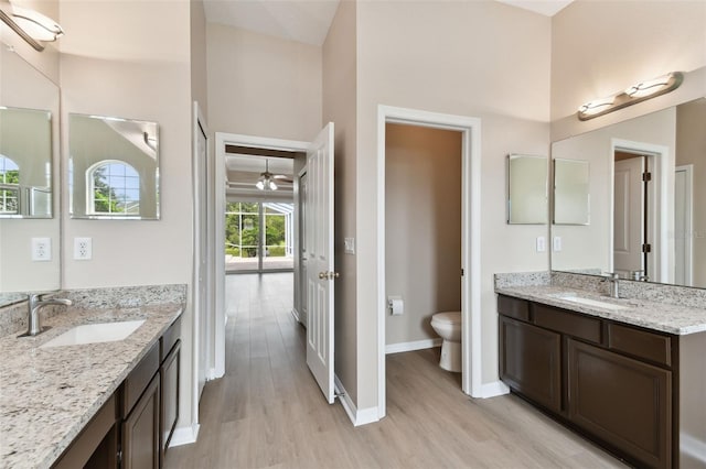 5321 Silver Charm Ter, Wesley Chapel, FL 33544 - full bathroom with wood finished floors, two vanities, and ceiling fan