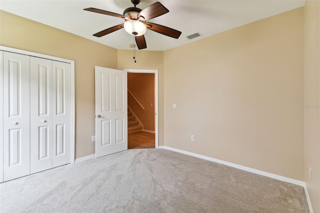 5321 Silver Charm Ter, Wesley Chapel, FL 33544 - unfurnished bedroom with carpet floors, a closet, and a ceiling fan