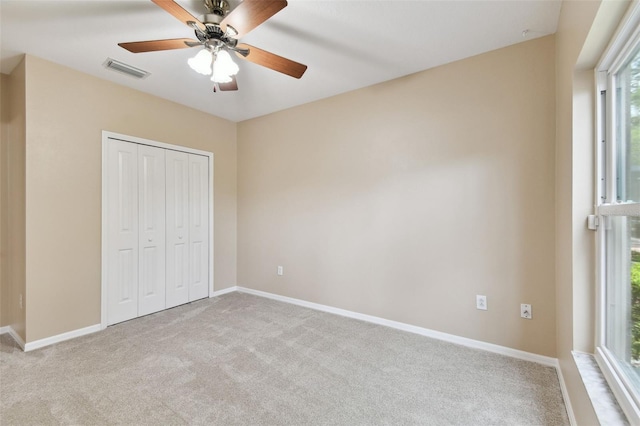 5321 Silver Charm Ter, Wesley Chapel, FL 33544 - unfurnished bedroom featuring carpet floors, a closet, and ceiling fan