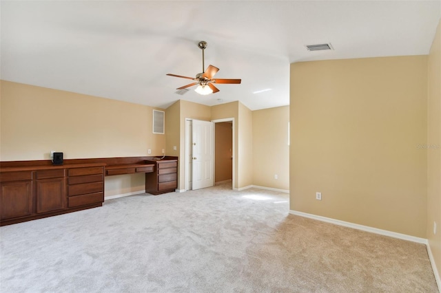 5321 Silver Charm Ter, Wesley Chapel, FL 33544 - unfurnished office featuring a ceiling fan, light colored carpet, built in desk, and vaulted ceiling