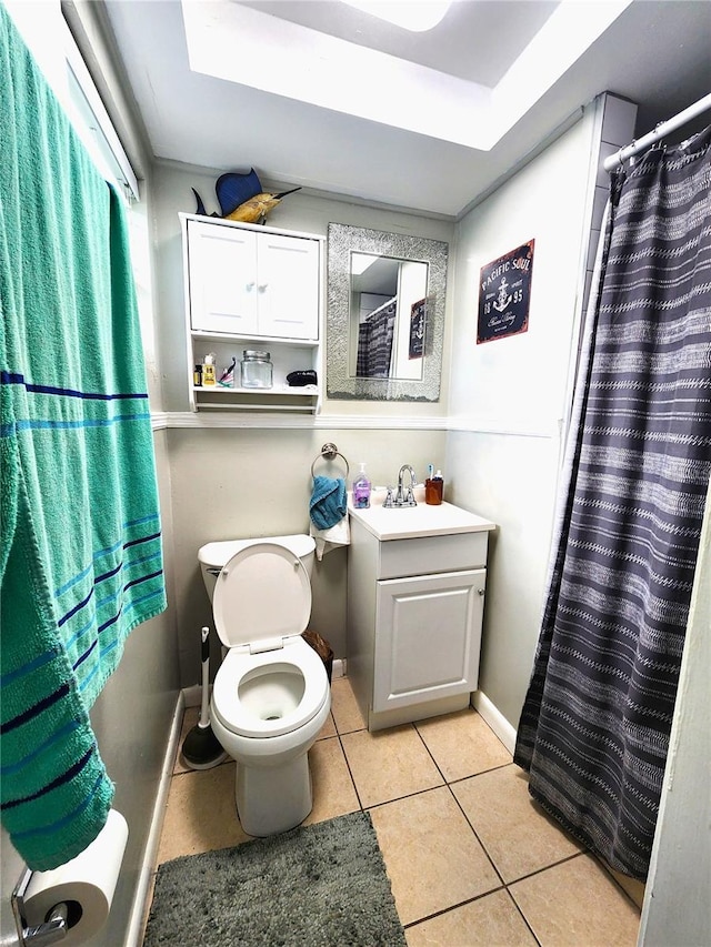 1205 Omaha Cir, Palm Harbor, FL 34683 - bathroom with tile patterned flooring, vanity, a raised ceiling, and curtained shower