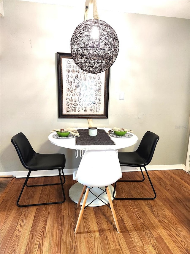 1205 Omaha Cir, Palm Harbor, FL 34683 - dining room featuring breakfast area and wood finished floors