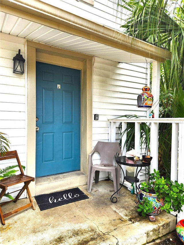 1205 Omaha Cir, Palm Harbor, FL 34683 - view of exterior entry with covered porch