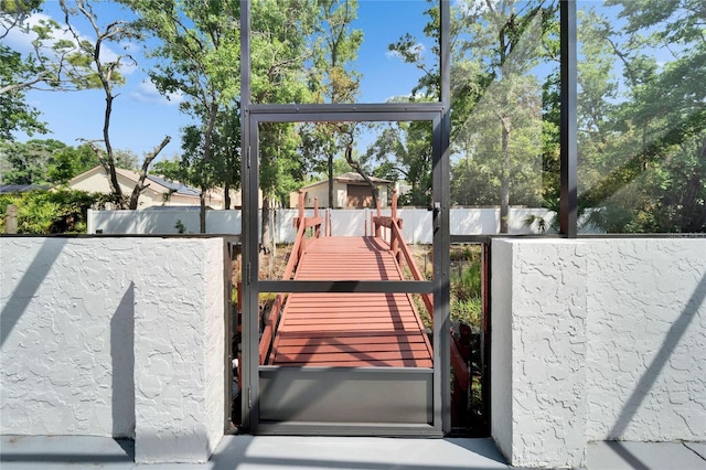 18852 Tracer Dr, Lutz, FL 33549 - dock featuring a fenced backyard