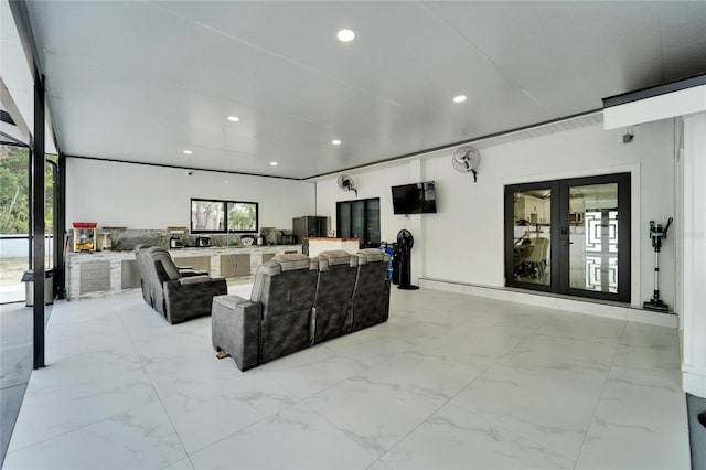 18852 Tracer Dr, Lutz, FL 33549 - living area featuring french doors, light marble finish flooring, and recessed lighting