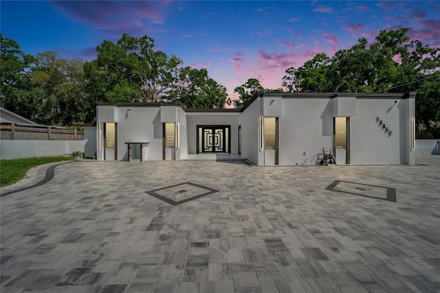 18852 Tracer Dr, Lutz, FL 33549 - modern home with stucco siding and a patio area