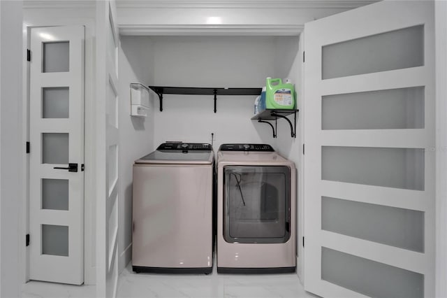 18852 Tracer Dr, Lutz, FL 33549 - laundry room with washing machine and dryer and light marble finish floors