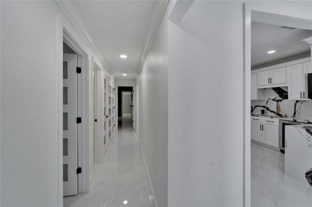 18852 Tracer Dr, Lutz, FL 33549 - corridor with light marble finish flooring, ornamental molding, and recessed lighting