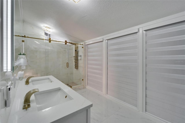 18852 Tracer Dr, Lutz, FL 33549 - bathroom with marble finish floors, double vanity, a textured ceiling, and a marble finish shower