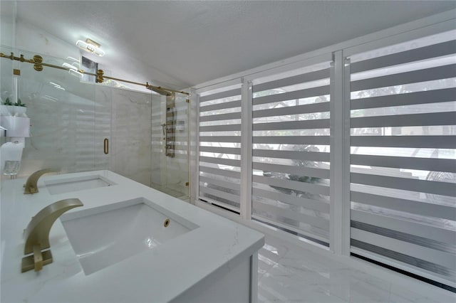 18852 Tracer Dr, Lutz, FL 33549 - bathroom with marble look tiles, a shower stall, vanity, and a textured ceiling