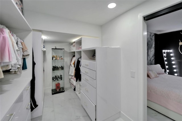 18852 Tracer Dr, Lutz, FL 33549 - walk in closet featuring light marble finish floors