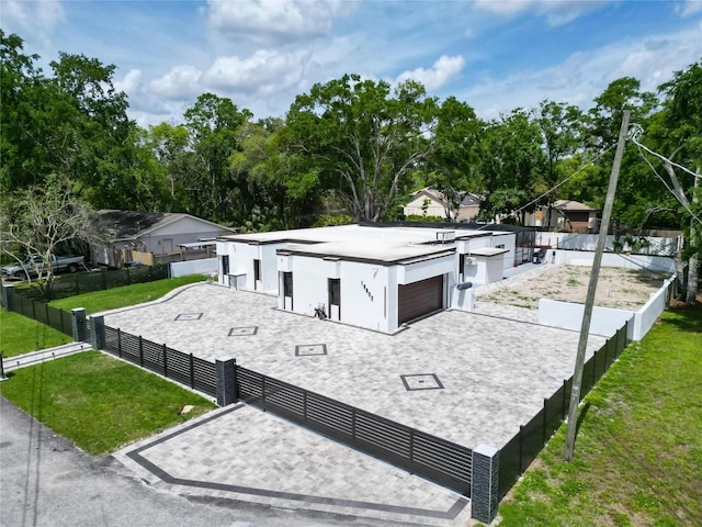 18852 Tracer Dr, Lutz, FL 33549 - view of front facade featuring decorative driveway, a garage, and stucco siding