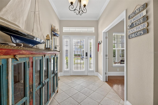 5720 Tortoise Pl, Apollo Beach, FL 33572 - entrance foyer featuring ornamental molding, light tile patterned floors, healthy amount of natural light, and a chandelier
