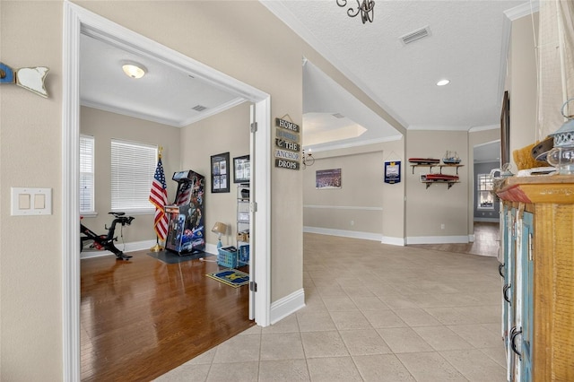 5720 Tortoise Pl, Apollo Beach, FL 33572 - hall with ornamental molding, light tile patterned flooring, and recessed lighting