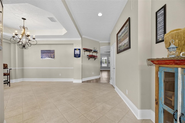 5720 Tortoise Pl, Apollo Beach, FL 33572 - spare room with a chandelier, crown molding, light tile patterned flooring, a textured ceiling, and recessed lighting