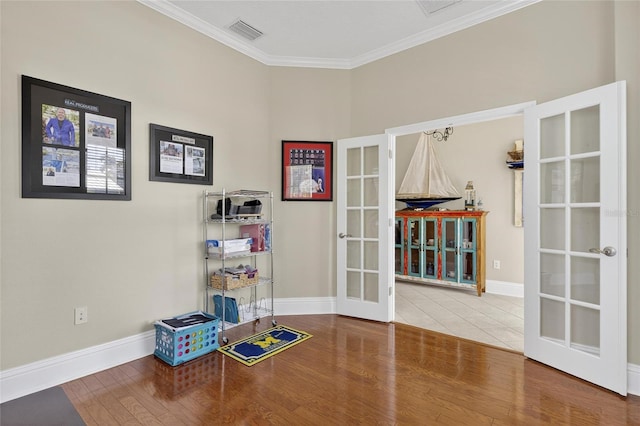 5720 Tortoise Pl, Apollo Beach, FL 33572 - game room with french doors, wood finished floors, and crown molding
