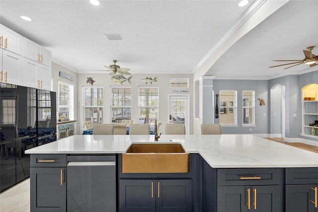 5720 Tortoise Pl, Apollo Beach, FL 33572 - kitchen featuring open floor plan, a ceiling fan, dishwasher, crown molding, and white cabinetry