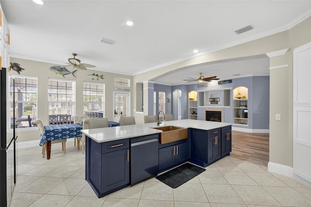 5720 Tortoise Pl, Apollo Beach, FL 33572 - kitchen with ceiling fan, dishwasher, open floor plan, a fireplace, and light countertops