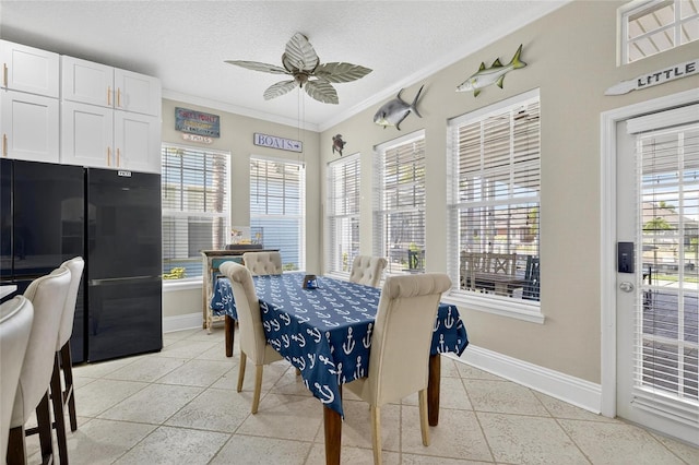 5720 Tortoise Pl, Apollo Beach, FL 33572 - dining area with crown molding, a ceiling fan, plenty of natural light, and a textured ceiling