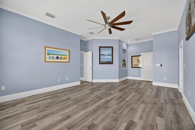 5720 Tortoise Pl, Apollo Beach, FL 33572 - unfurnished living room with a ceiling fan, dark wood-type flooring, ornamental molding, and a textured ceiling