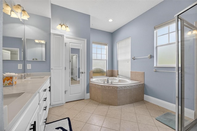 5720 Tortoise Pl, Apollo Beach, FL 33572 - bathroom featuring a bath, double vanity, tile patterned floors, and a shower stall