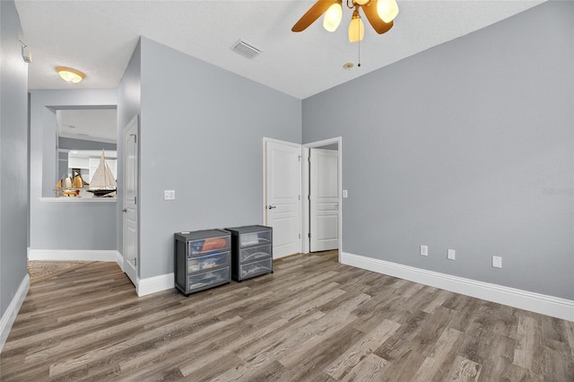 5720 Tortoise Pl, Apollo Beach, FL 33572 - unfurnished bedroom with wood finished floors and ceiling fan